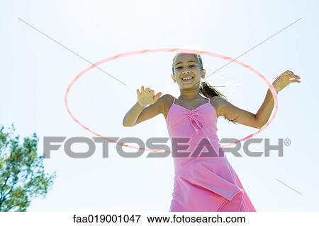 Girl with hoola hoop View Large Photo Image Stock Photo - Girl with hoola hoop. Fotosearch
