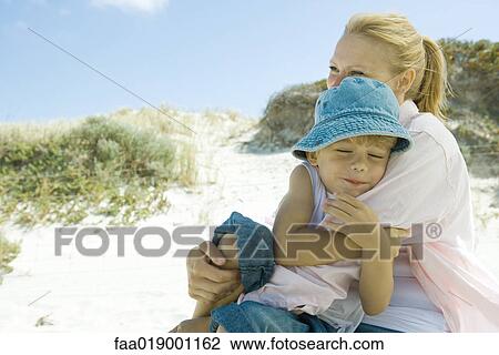 Little boy with mother on beach View Large Photo Image Stock Image - Little boy with mother on beach. Fotosearch