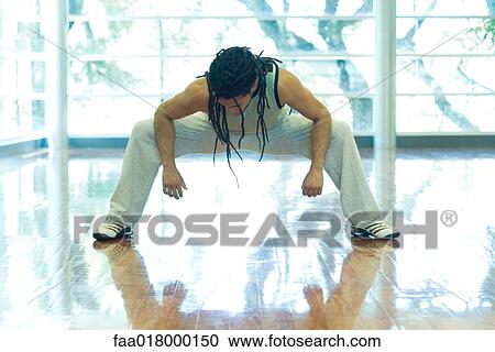 Man doing squat, full length View Large Photo Image Stock Image - Man doing squat, full length. Fotosearch