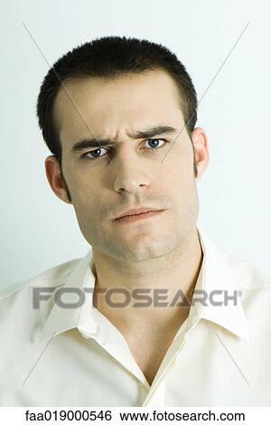 Man furrowing brow, portrait View Large Photo Image Stock Photograph - Man furrowing brow, portrait. Fotosearch