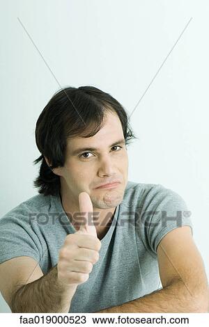 Man giving thumbs up sign, smiling, portrait View Large Photo Image Stock Image - Man giving thumbs up sign, smiling, portrait. Fotosearch