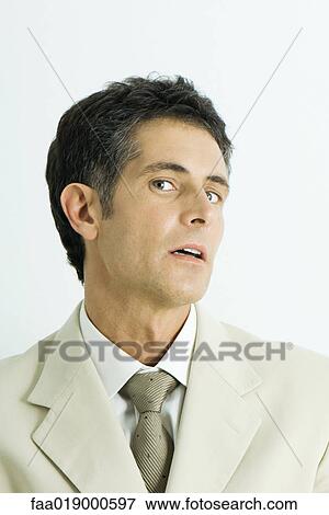 Man, head back, giving sideways look at camera, portrait View Large Photo Image Stock Photo - Man, head back, giving sideways look at camera, portrait. Fotosearch
