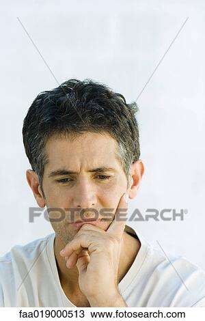 Man, holding head, looking down, portrait View Large Photo Image Stock Image - Man, holding head, looking down, portrait. Fotosearch