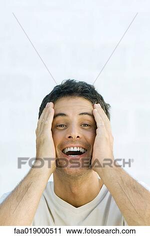 Man, holding head, smiling, portrait View Large Photo Image Stock Image - Man, holding head, smiling, portrait. Fotosearch