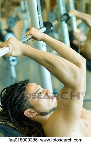 Stock Photograph - Man lifting barbell. Fotosearch