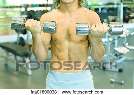 Man lifting dumbbells, close-up of torso View Large Photo Image Stock Image - Man lifting dumbbells, close-up of torso. Fotosearch