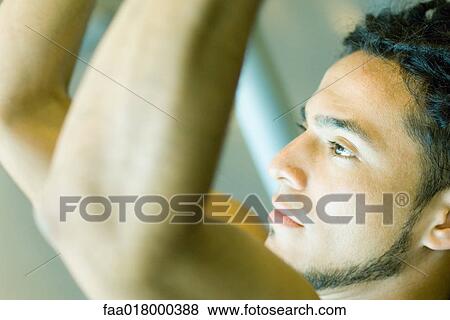 Man lifting weights, close-up, side view View Large Photo Image Stock Photo - Man lifting weights, close-up, side view. Fotosearch
