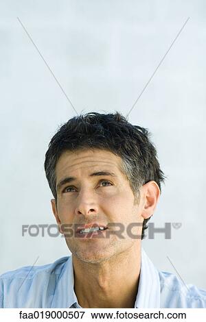 Man, looking up, portrait View Large Photo Image Stock Photo - Man, looking up, portrait. Fotosearch