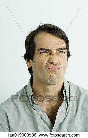 Man making sour face, portrait View Large Photo Image Stock Photograph - Man making sour face, portrait. Fotosearch