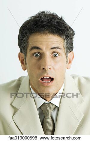 Man making surprised face, portrait View Large Photo Image Stock Photo - Man making surprised face, portrait. Fotosearch