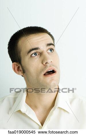 Stock Photography - Man making surprised face, portrait. Fotosearch