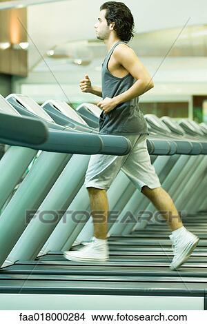 Man running on treadmill View Large Photo Image Picture - Man running on treadmill. Fotosearch