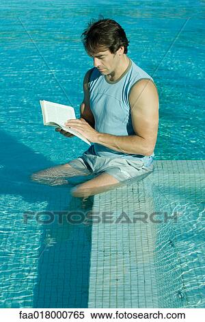 Man sitting in pool, reading View Large Photo Image Stock Photography - Man sitting in pool, reading. Fotosearch