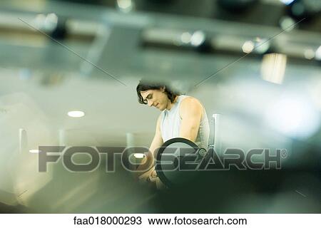 Man standing over barbell View Large Photo Image Stock Image - Man standing over barbell. Fotosearch