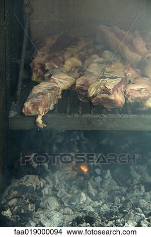 Meat grilling in barbecue View Large Photo Image Picture - Meat grilling in barbecue. Fotosearch