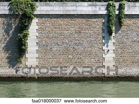 Stock Photo - Paris, France, Ile de le cite, close-up of island wall. Fotosearch