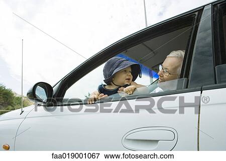 Senior woman and baby in car View Large Photo Image Stock Photo - Senior woman and baby in car. Fotosearch