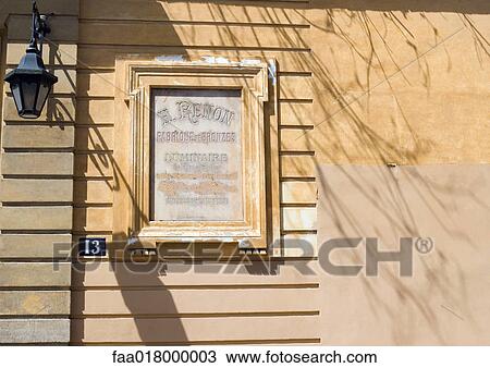Stock Image - Shop sign on wall. Fotosearch