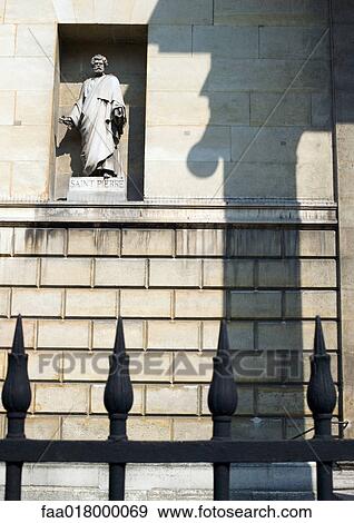 Statue of St. Peter in wall alcove, iron gate in foreground View Large Photo Image Stock Photo - Statue of St. Peter in wall alcove, iron gate in foreground. Fotosearch