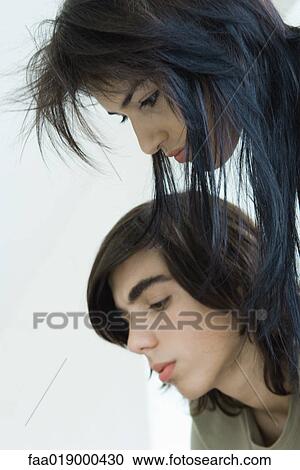 Teen boy and young woman, side view, portrait View Large Photo Image Stock Image - Teen boy and young woman, side view, portrait. Fotosearch
