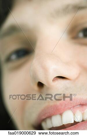 Teen boy smiling at camera, extreme close-up View Large Photo Image Stock Photo - Teen boy smiling at camera, extreme close-up. Fotosearch