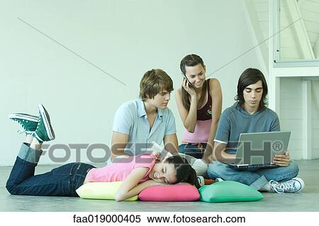 Stock Photography - Teen friends hanging out together. Fotosearch