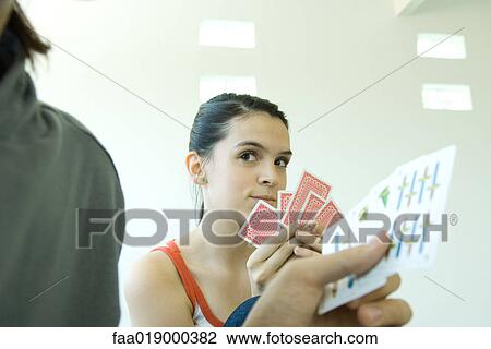 Teen friends playing cards View Large Photo Image Stock Image - Teen friends playing cards. Fotosearch