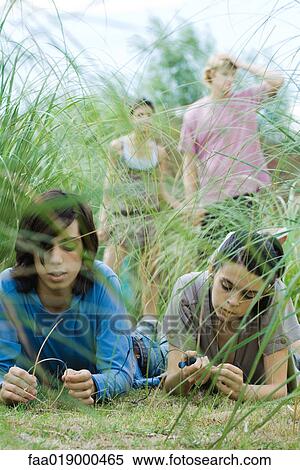 Teen friends sharing MP3 player View Large Photo Image Stock Photography - Teen friends sharing MP3 player. Fotosearch