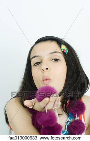 Teen girl blowing kiss, portrait View Large Photo Image Stock Image - Teen girl blowing kiss, portrait. Fotosearch