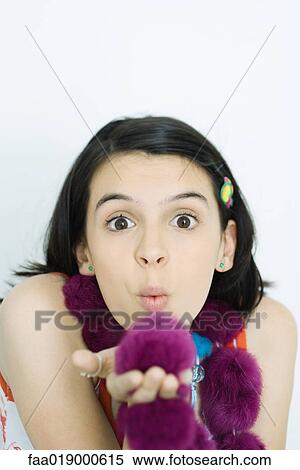Teen girl blowing kiss, portrait View Large Photo Image Stock Photography - Teen girl blowing kiss, portrait. Fotosearch