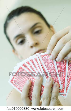 Teen girl holding hand of cards View Large Photo Image Stock Image - Teen girl holding hand of cards. Fotosearch