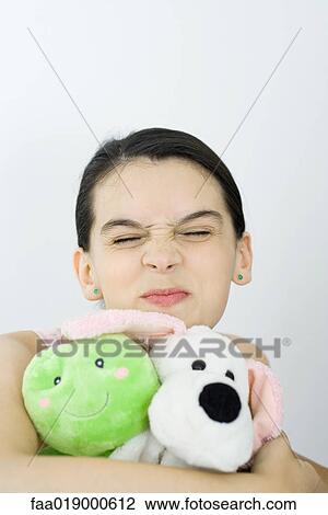 Teen girl holding stuffed animals, portrait View Large Photo Image Stock Image - Teen girl holding stuffed animals, portrait. Fotosearch
