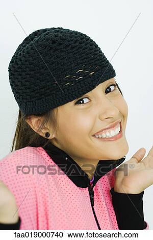 Teen girl, holding up hands, smiling at camera, portrait View Large Photo Image Stock Image - Teen girl, holding up hands, smiling at camera, portrait. Fotosearch
