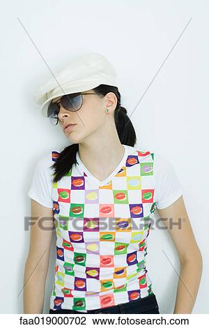 Teen girl wearing cap and sunglasses, portrait View Large Photo Image Stock Image - Teen girl wearing cap and sunglasses, portrait. Fotosearch