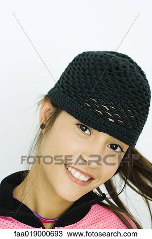 Teen girl wearing knit hat, portrait View Large Photo Image Stock Image - Teen girl wearing knit hat, portrait. Fotosearch
