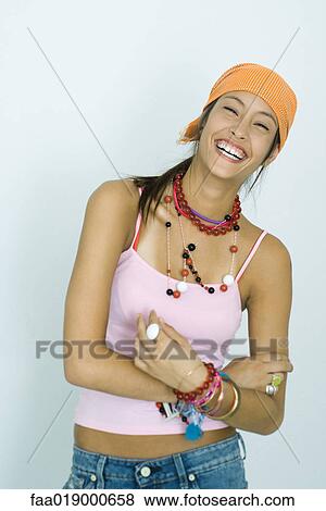Teen girl wearing lots of accessories, laughing, portrait View Large Photo Image Stock Photo - Teen girl wearing lots of accessories, laughing, portrait. Fotosearch