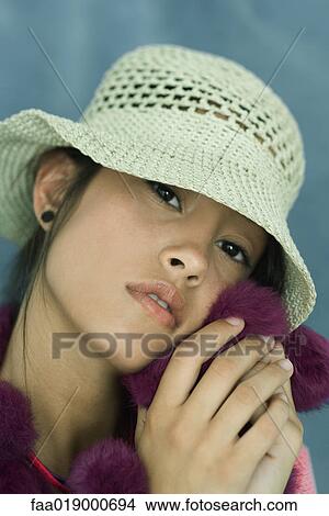 Teen girl wearing sun hat, close-up, portrait View Large Photo Image Picture - Teen girl wearing sun hat, close-up, portrait. Fotosearch