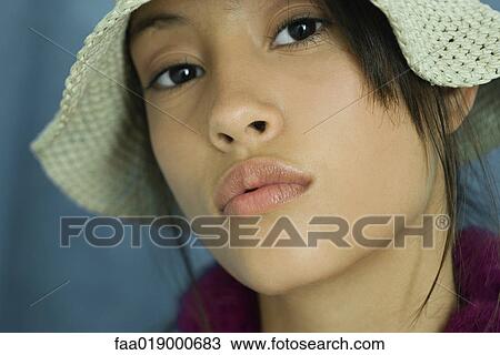Teen girl wearing sun hat, close-up, portrait View Large Photo Image Stock Image - Teen girl wearing sun hat, close-up, portrait. Fotosearch