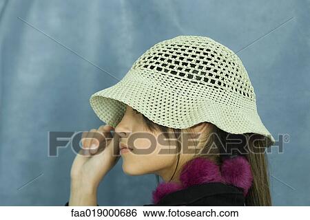 Teen girl wearing sun hat, close-up, portrait View Large Photo Image Stock Photograph - Teen girl wearing sun hat, close-up, portrait. Fotosearch