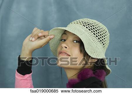 Teen girl wearing sun hat, close-up, portrait View Large Photo Image Stock Photography - Teen girl wearing sun hat, close-up, portrait. Fotosearch