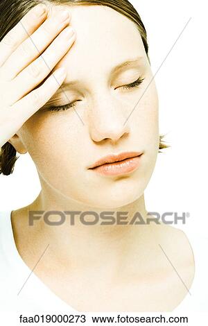 Teenage girl rubbing forehead, eyes closed View Large Photo Image Stock Image - Teenage girl rubbing forehead, eyes closed. Fotosearch
