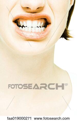 Teenage girl showing teeth, extreme close-up View Large Photo Image Stock Image - Teenage girl showing teeth, extreme close-up. Fotosearch