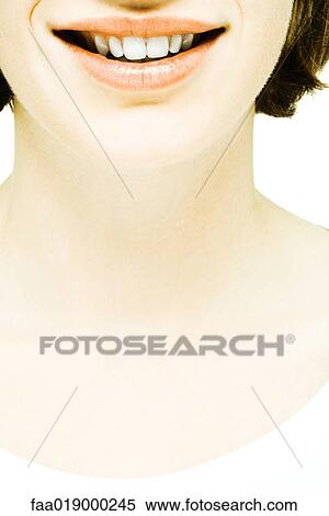 Teenage girl smiling, lower part of face and neck, close-up View Large Photo Image Stock Photography - Teenage girl smiling, lower part of face and neck, close-up. Fotosearch