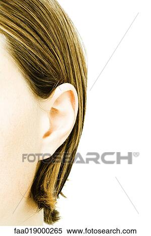 Stock Photography - Teenage girl's ear, extreme close-up. Fotosearch