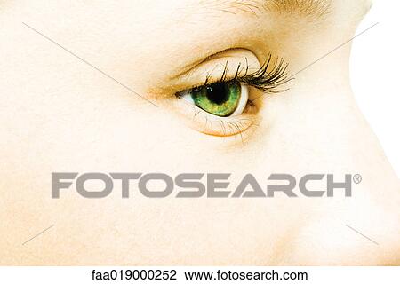 Stock Image - Teenage girl's eye, extreme close-up. Fotosearch