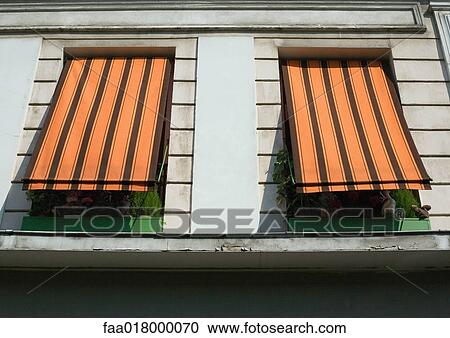 Two striped awnings pulled down over windows, low angle view View Large Photo Image Stock Image - Two striped awnings pulled down over windows, low angle view. Fotosearch