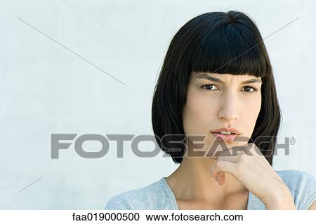 Woman, hand under chin, portrait View Large Photo Image Stock Image - Woman, hand under chin, portrait. Fotosearch
