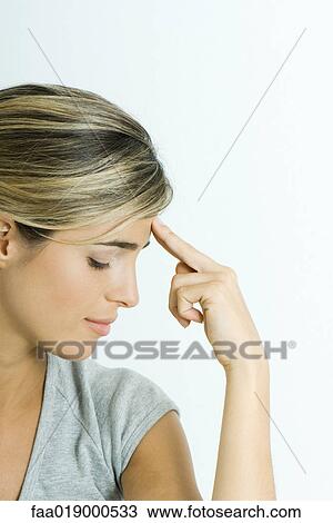 Stock Image - Woman, holding head, portrait. Fotosearch