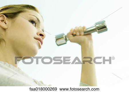 Woman lifting dumbbell View Large Photo Image Stock Photo - Woman lifting dumbbell. Fotosearch