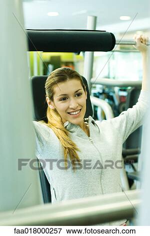 Woman lifting weights View Large Photo Image Stock Photo - Woman lifting weights. Fotosearch